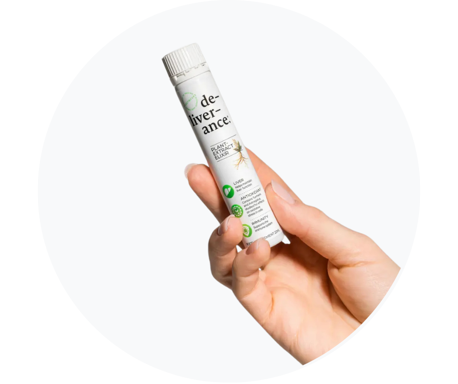 Hand holding a white de-liver-ance plant extract elixir bottle showing liver support ingredients including dandelion, artichoke, and turmeric against a white circular background